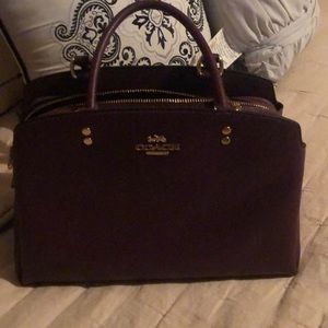 Crossgrain leather, inside zip and multifunction pockets